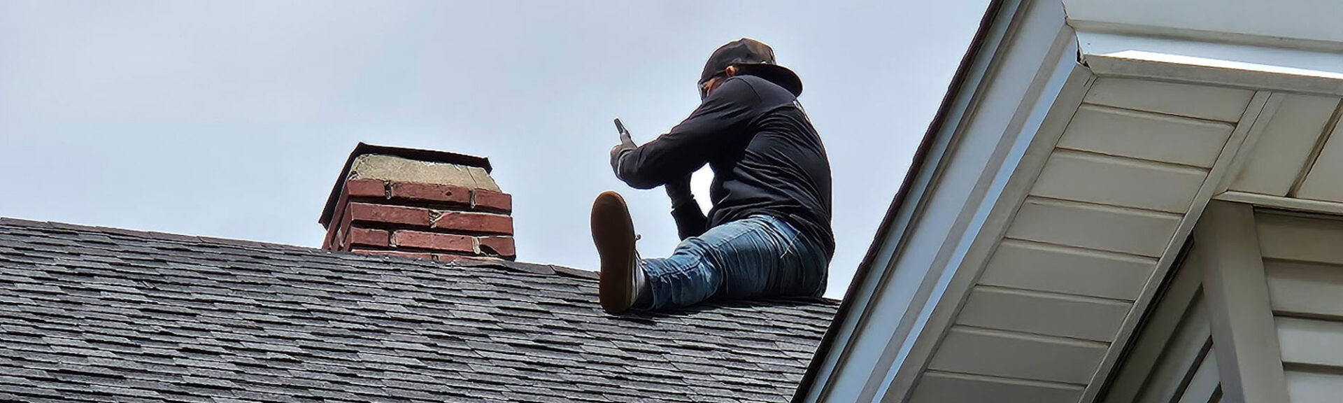 Man Doing Work On Chimney